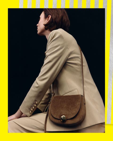 A woman with a suede handbag.