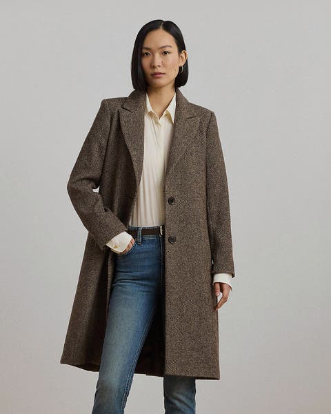 A woman in a brown tailored wool coat.