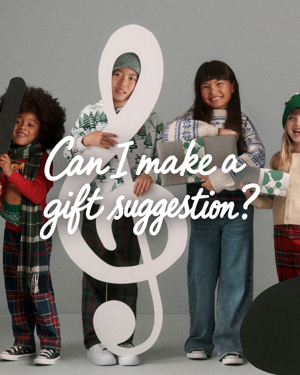 Kids holding music notes and gifts.