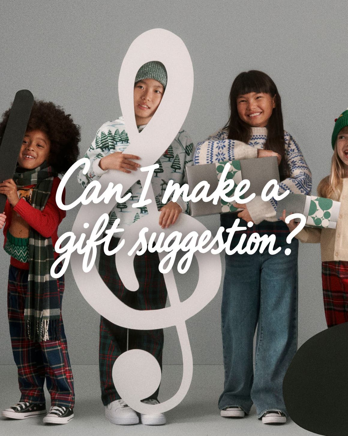 Kids holding music notes and gifts.