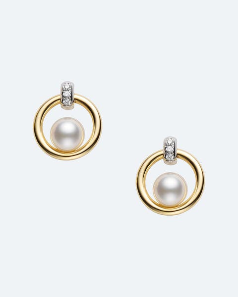 Gold hoop earrings with a pearl and pavé diamond accent.