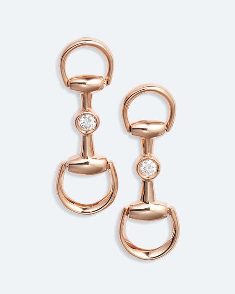 Pink gold earrings by Gucci.
