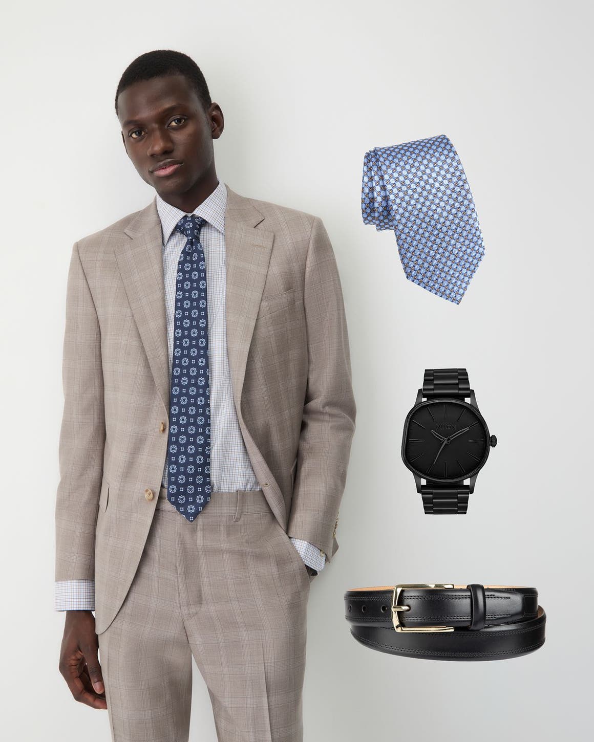 A man in a light-check linen suit and patterned blue silk tie.