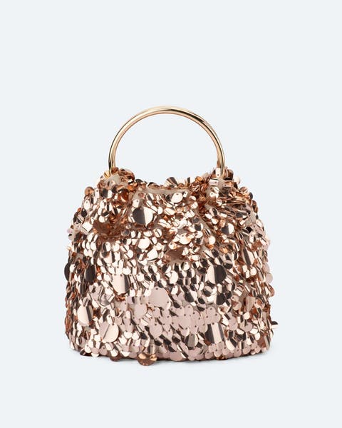 A rose-gold, sequined handbag.