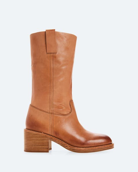 A caramel block-heeled midi boot.