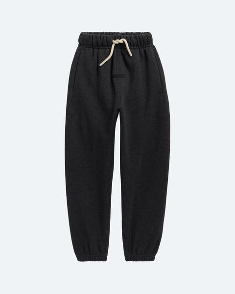 A pair of black sweatpants for little boys.