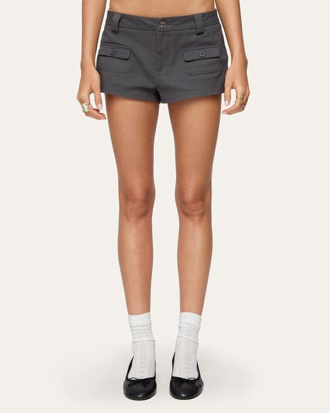 A woman wearing grey micro shorts.