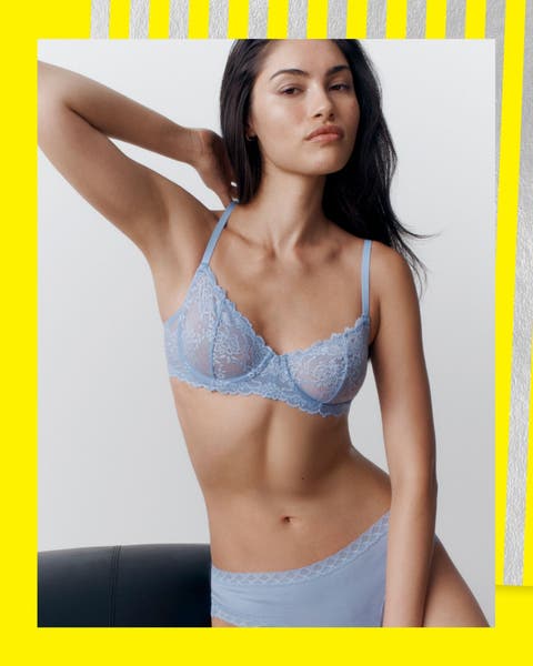 A woman in a lavender lace bra and pantie set.