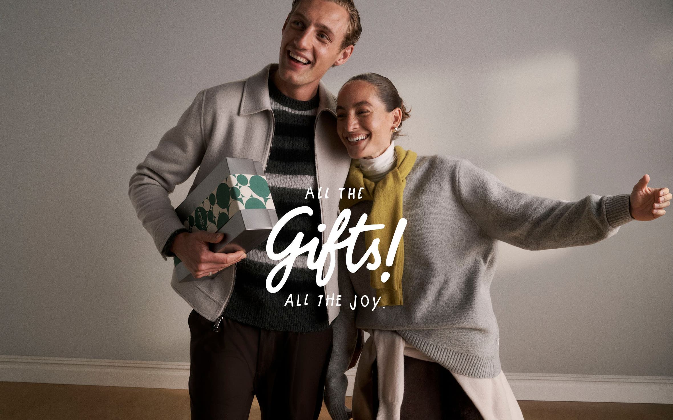 All the gifts! All the joy. A man and woman with a gift.