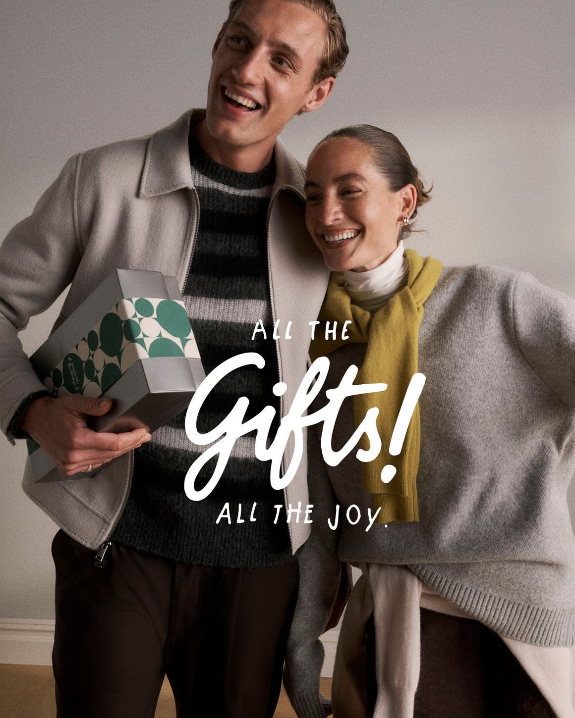 All the gifts! All the joy. A man and woman with a gift.