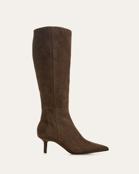 A product shot of a tall brown boot.