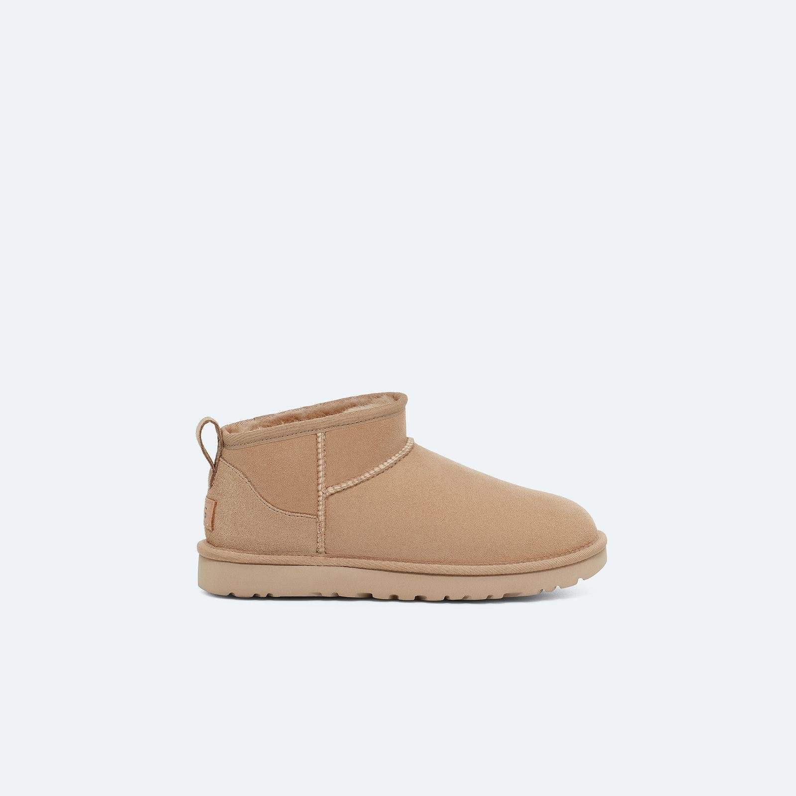 Beige ankle UGGs. 
