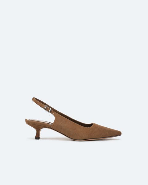 Brown suede kitten-heeled slingbacks.