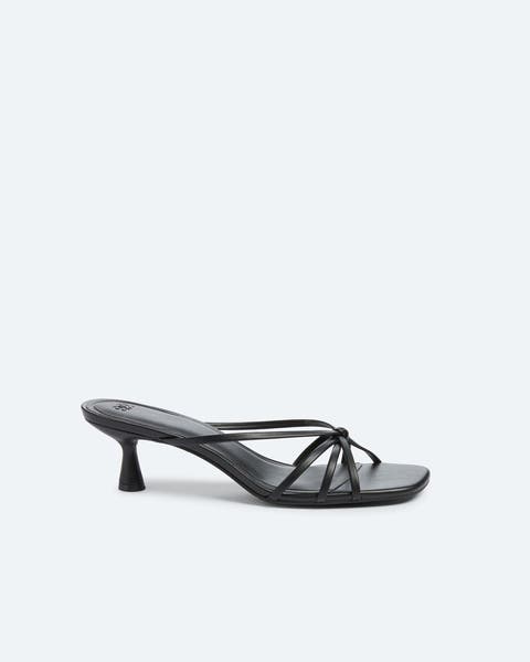 Black kitten-heel sandals.