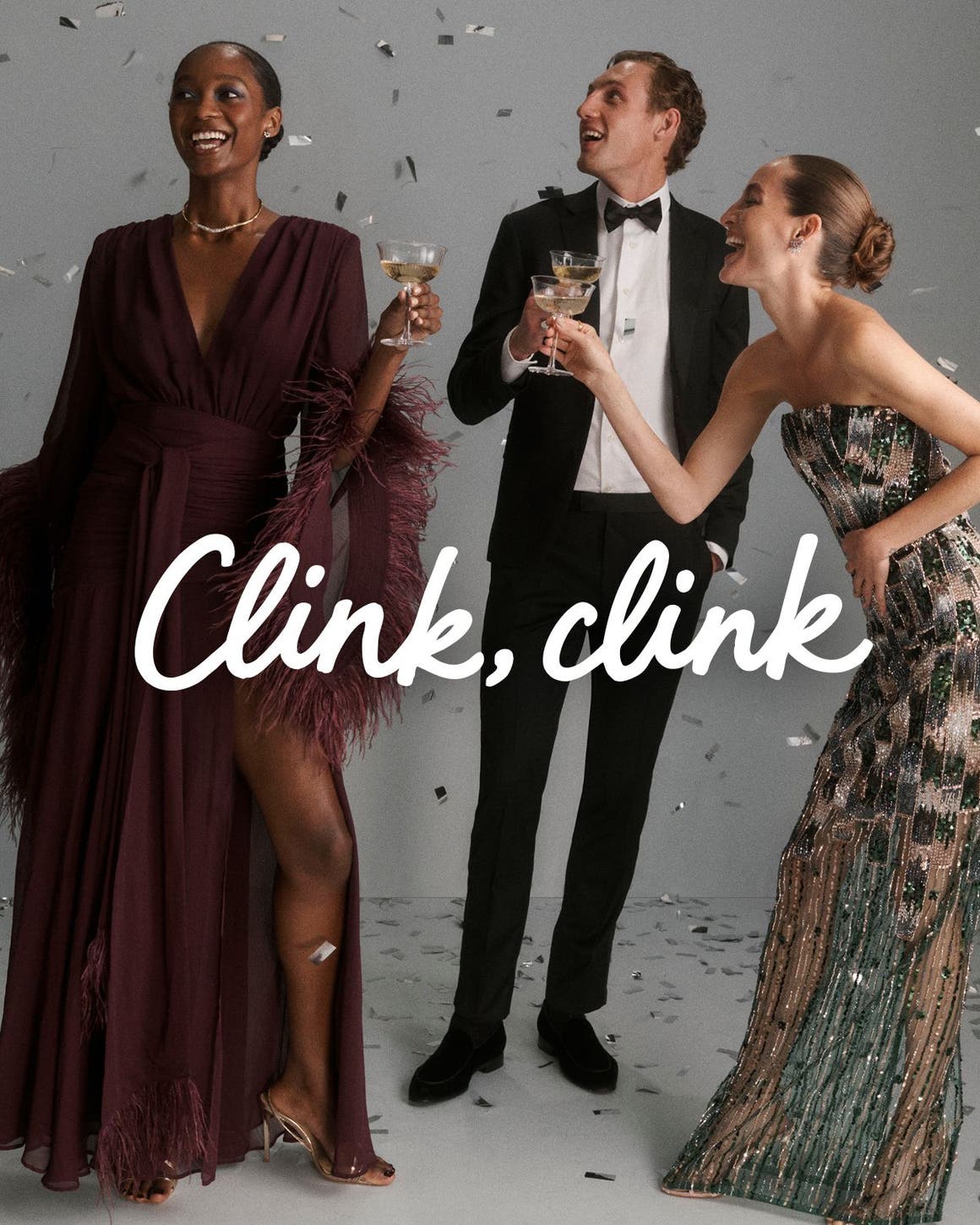 Clink clink. Men and women in formalwear, holding drinks and surrounded by confetti.