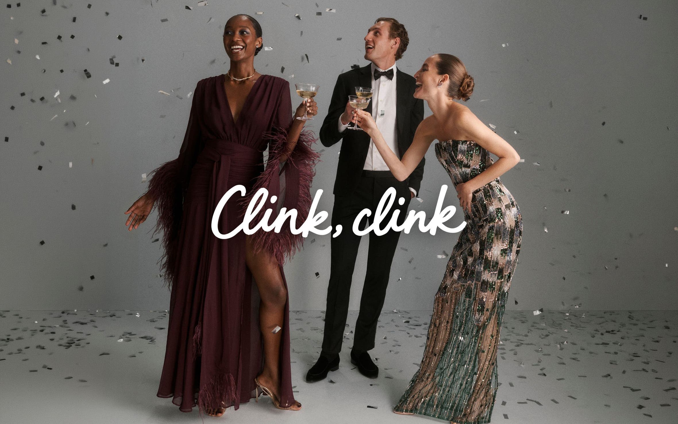 Clink clink. Men and women in formalwear, holding drinks and surrounded by confetti.