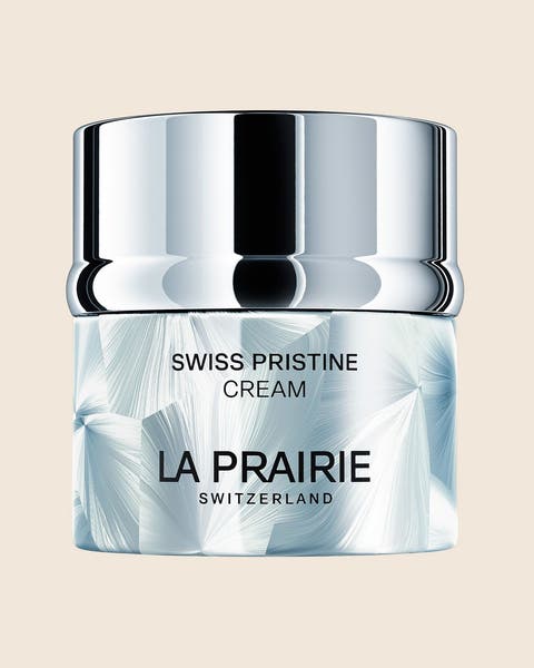 A La Prairie Swiss Pristine Cream jar with a silver lid.