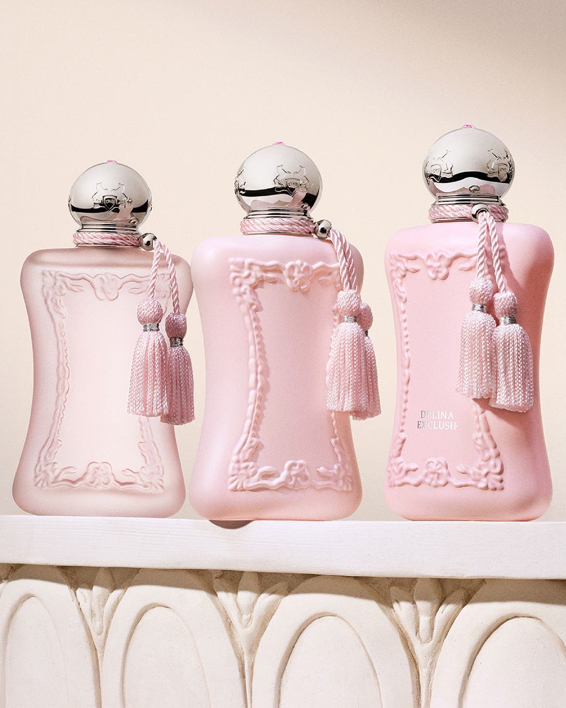 Three bottles of Parfums de Marly fragrance.