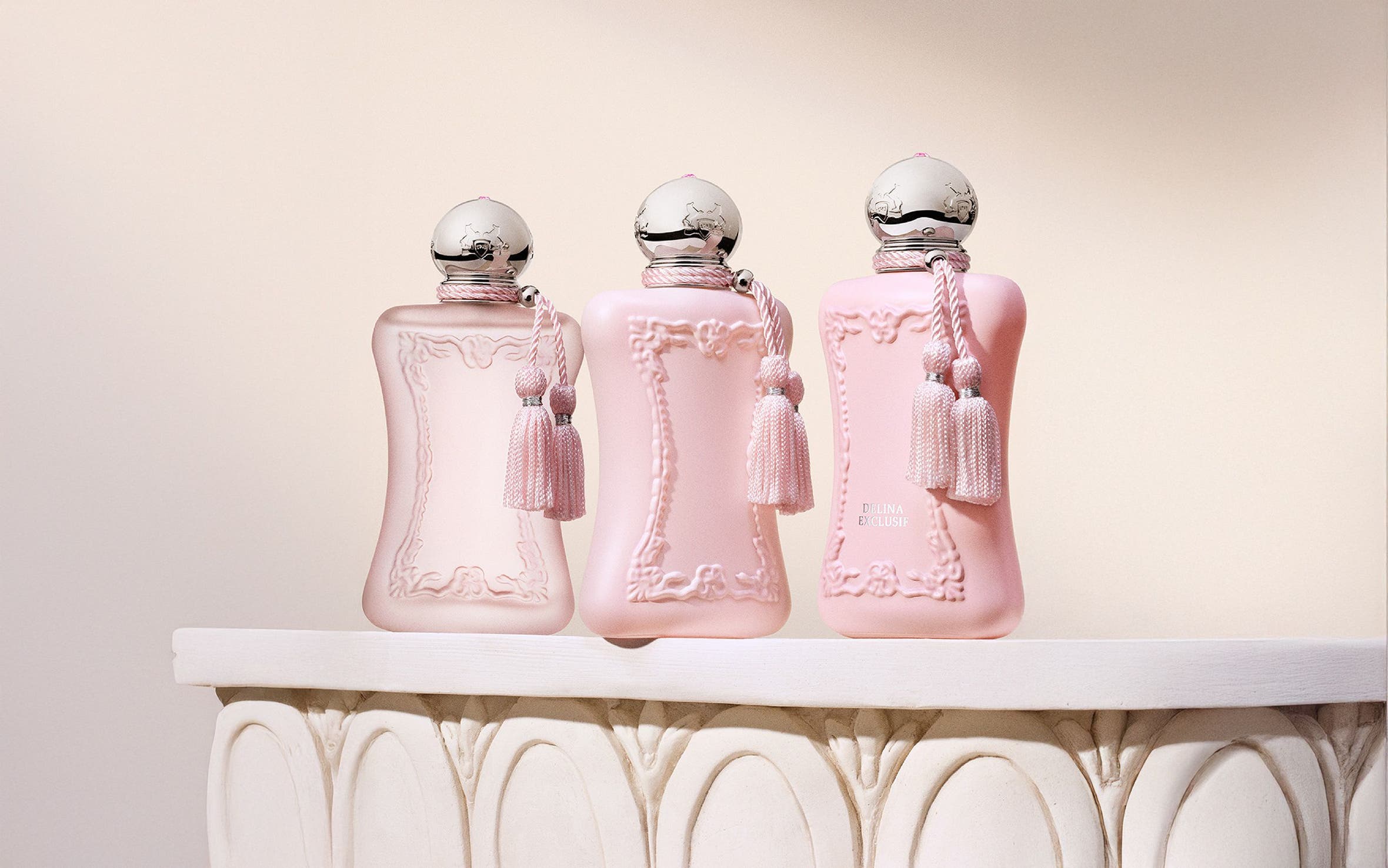 Three bottles of Parfums de Marly fragrance.