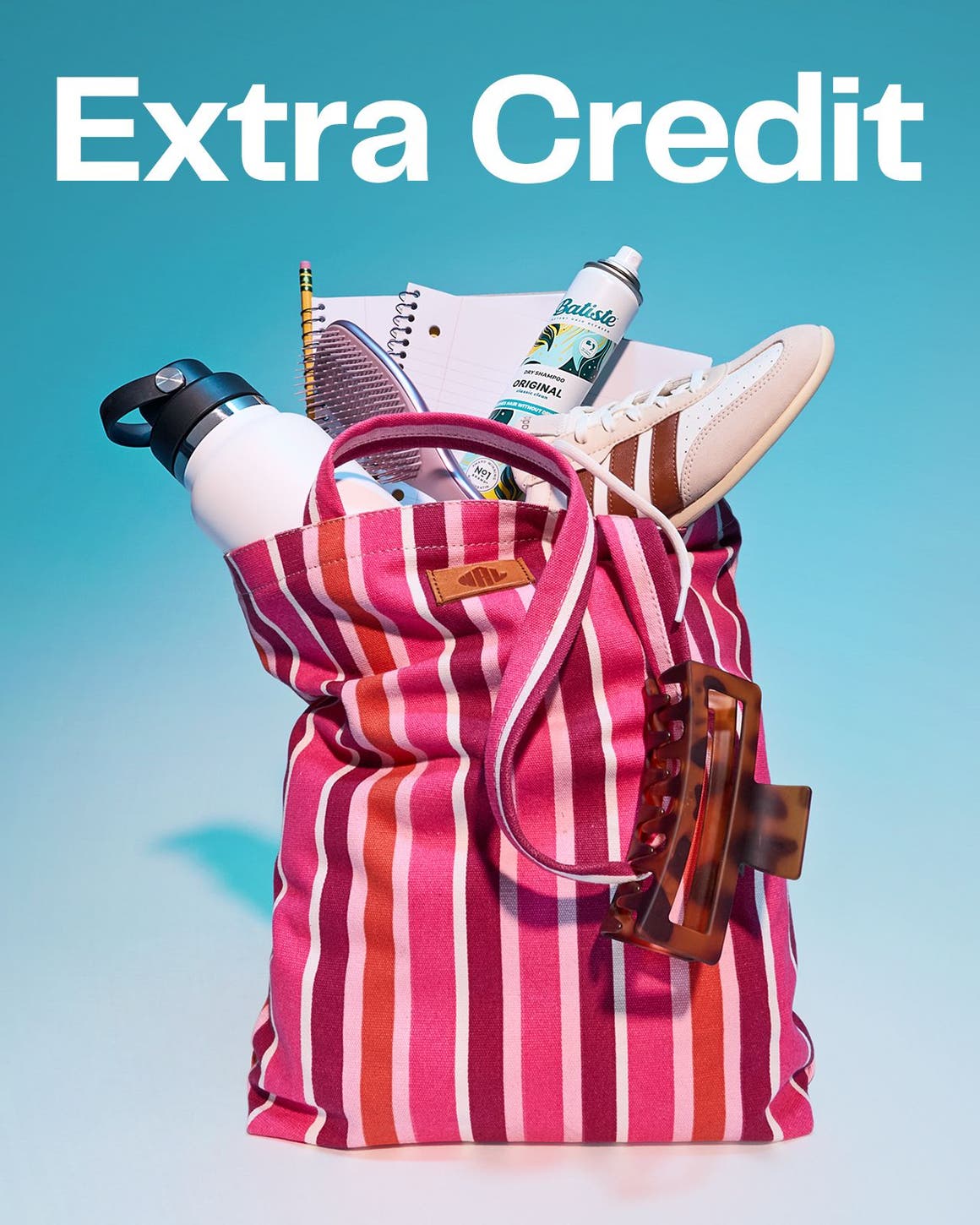 Extra credit. A multicolored tote bag stuffed with school supplies.  