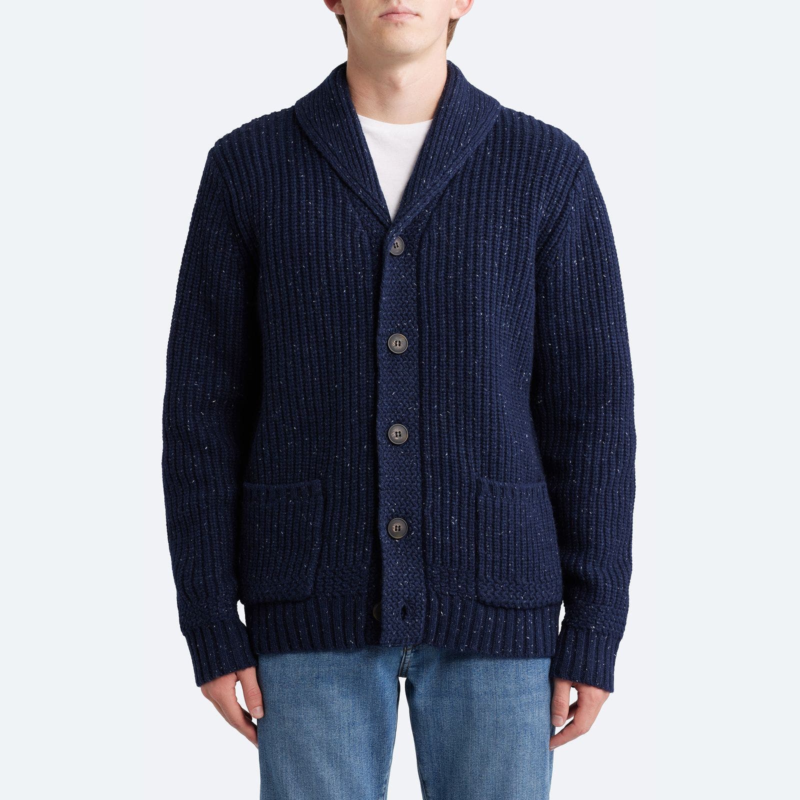 A man wearing blue cardigan. 