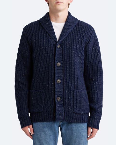 A man wearing blue cardigan.