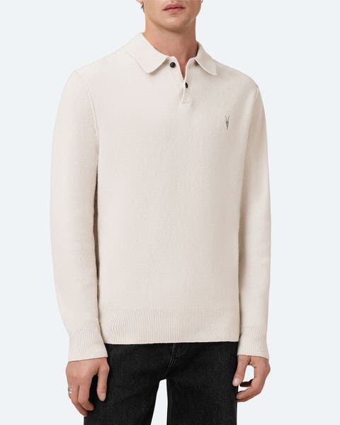 A man wearing beige sweater polo.