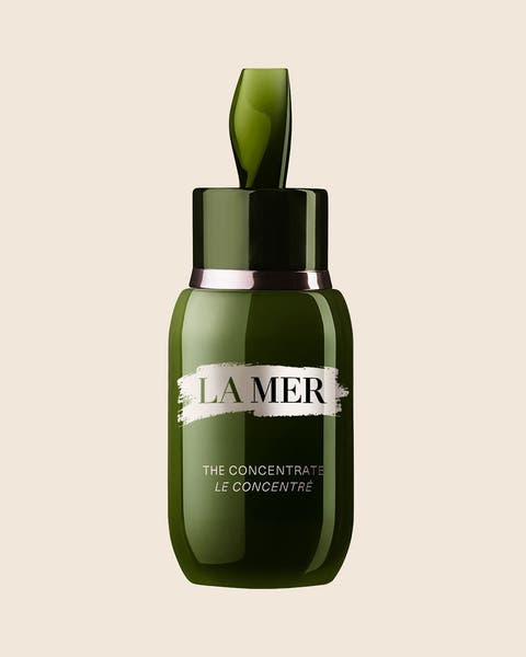A La Mer The Concentrate serum in a green glass bottle with a silver band.