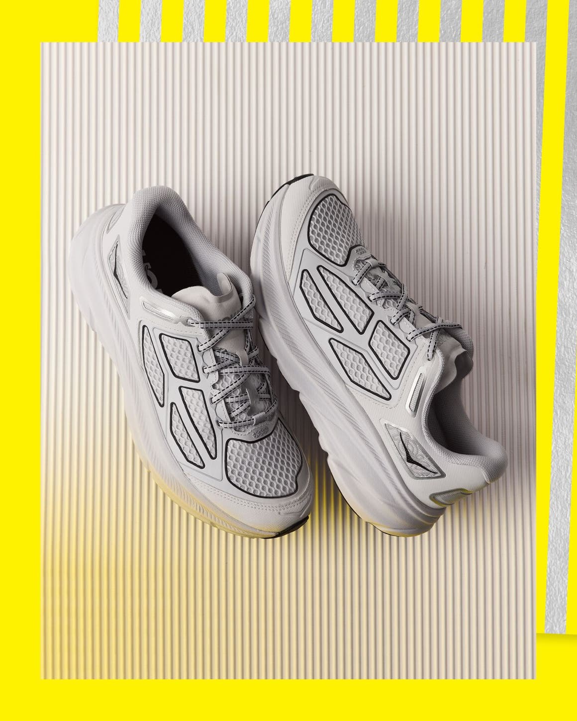 Men’s grey, white and black sneakers.
