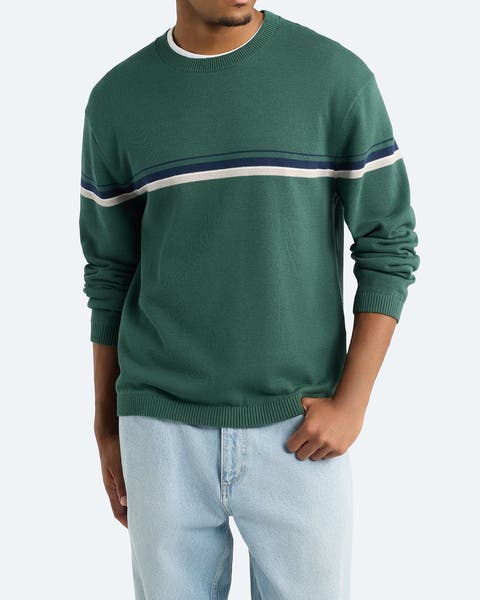 A man wearing green striped sweater.