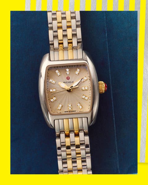 A gold Michele bracelet watch. 