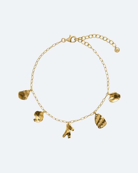 Yellow-gold bracelet with organic gold charms.