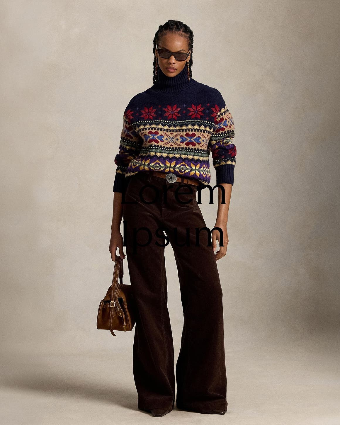 A woman wearing a fair isle sweater and dark brown corduroy pants.