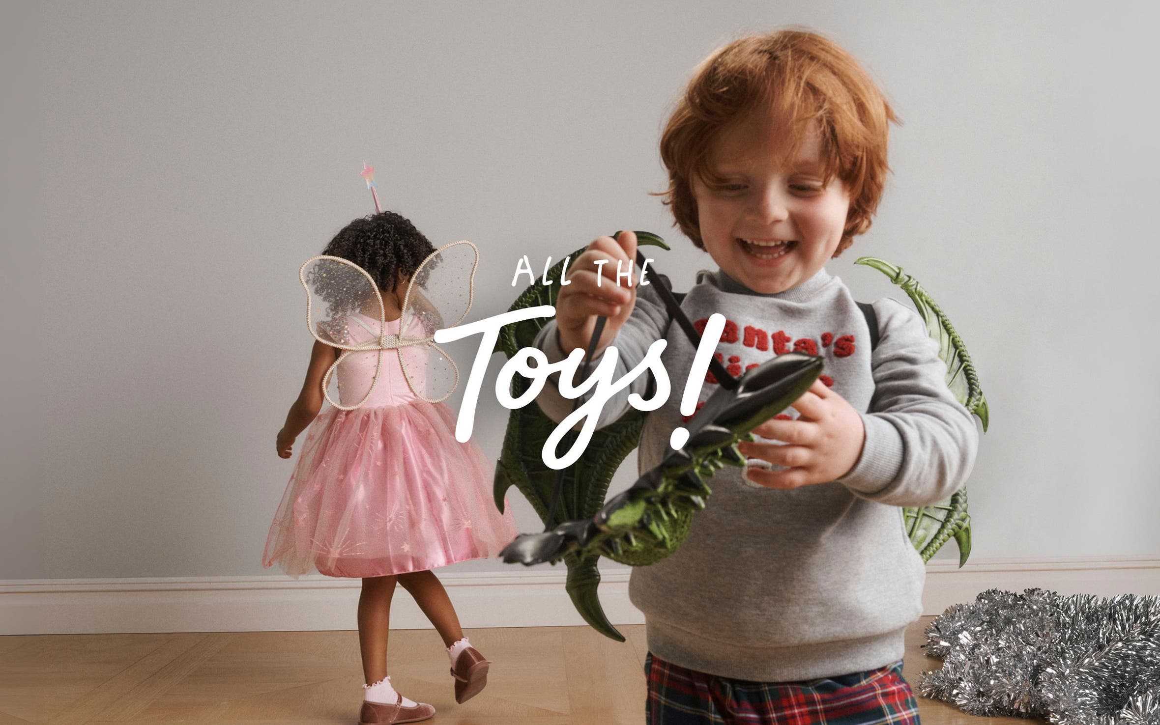All the toys. A boy with a mask and a girl dressed as a fairy.