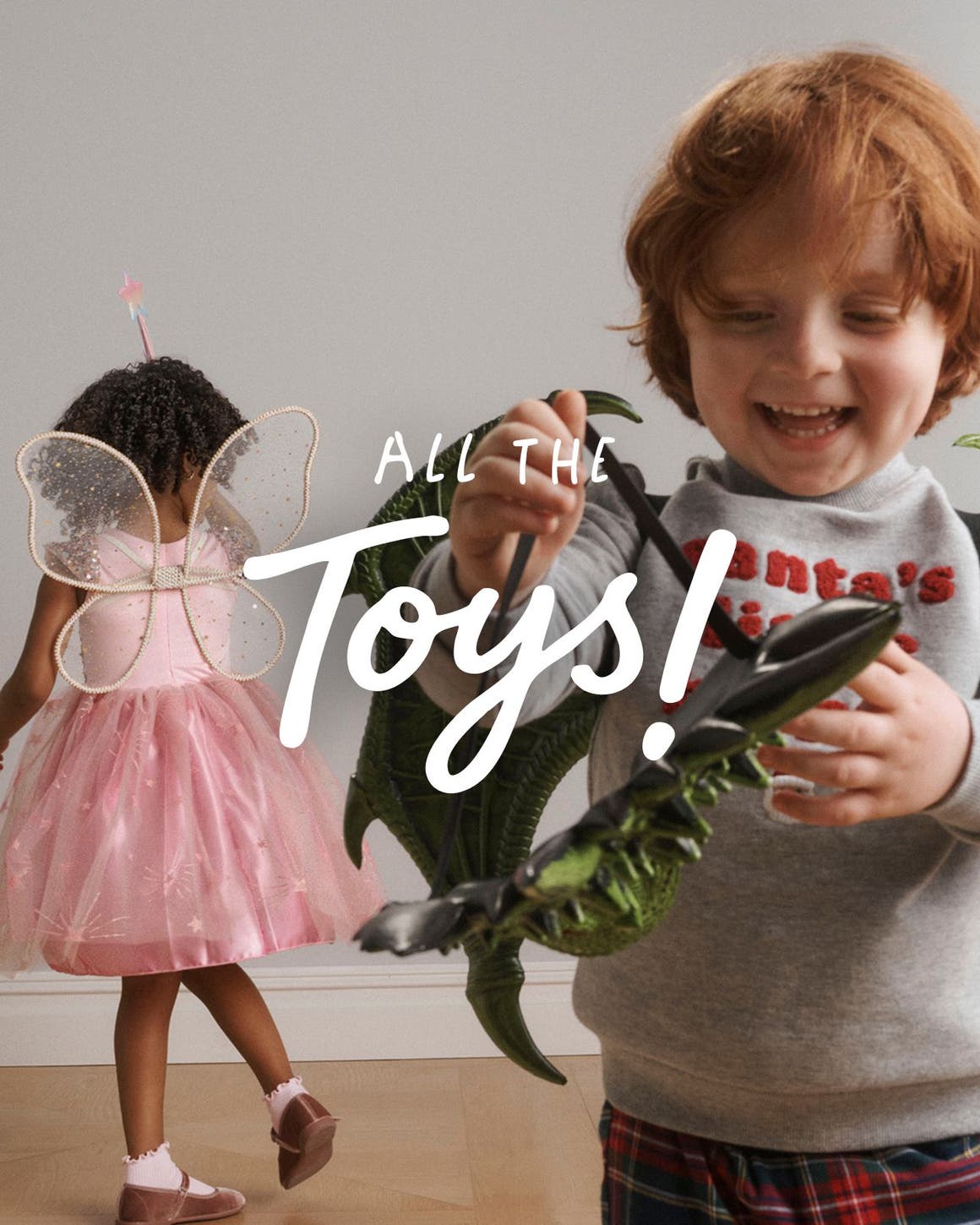 All the toys. A boy with a mask and a girl dressed as a fairy.
