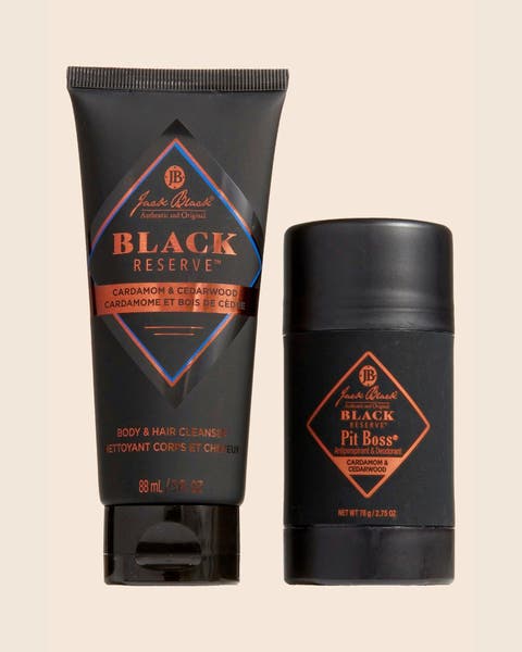 A Jack Black Black Reserve body and hair cleanser tube beside a Pit Boss deodorant stick.