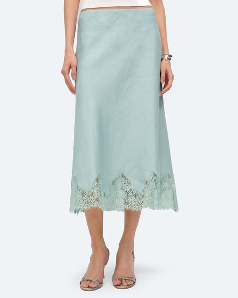 A linen mint green skirt with lace appliqué.