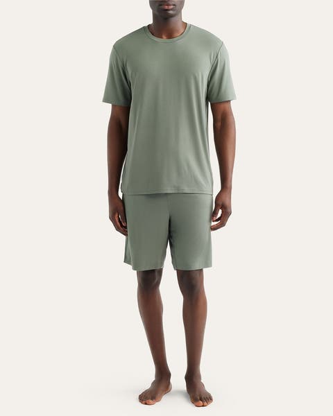 Image of man in green pajama shorts set.