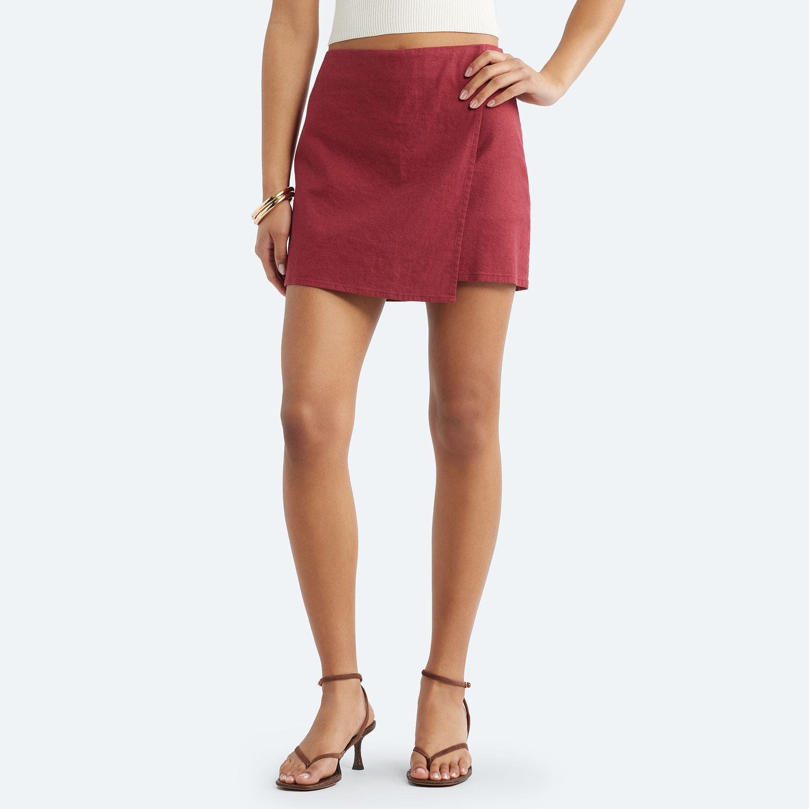 A burgundy linen faux-wrap mini skort.