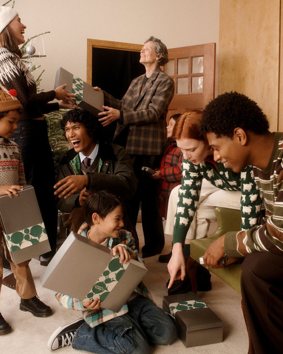 Adults and kids exchanging gifts.