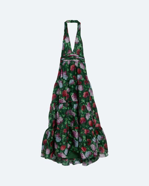 Green floral halter maxi dress with a plunging V-neckline, tie-neck strap, fitted bodice, and a flowing tiered skirt in a red, pink, and white floral print.