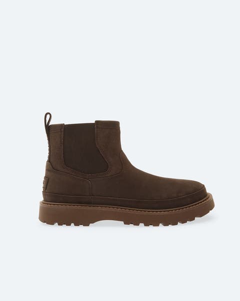 Brown UGG boot.