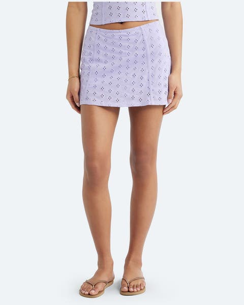 A purple eyelet mini skirt.