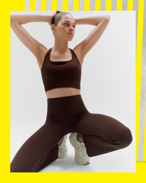 A woman wearing active leggings and a matching sports bra.