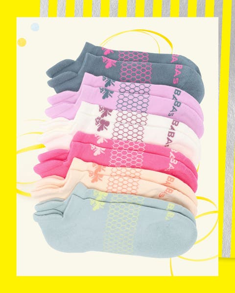 A row of colorful ankle-tab socks in spring hues.