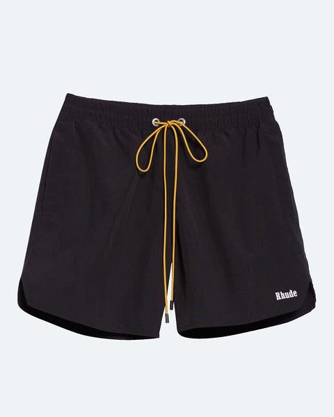 Black shorts with yellow drawstrings.