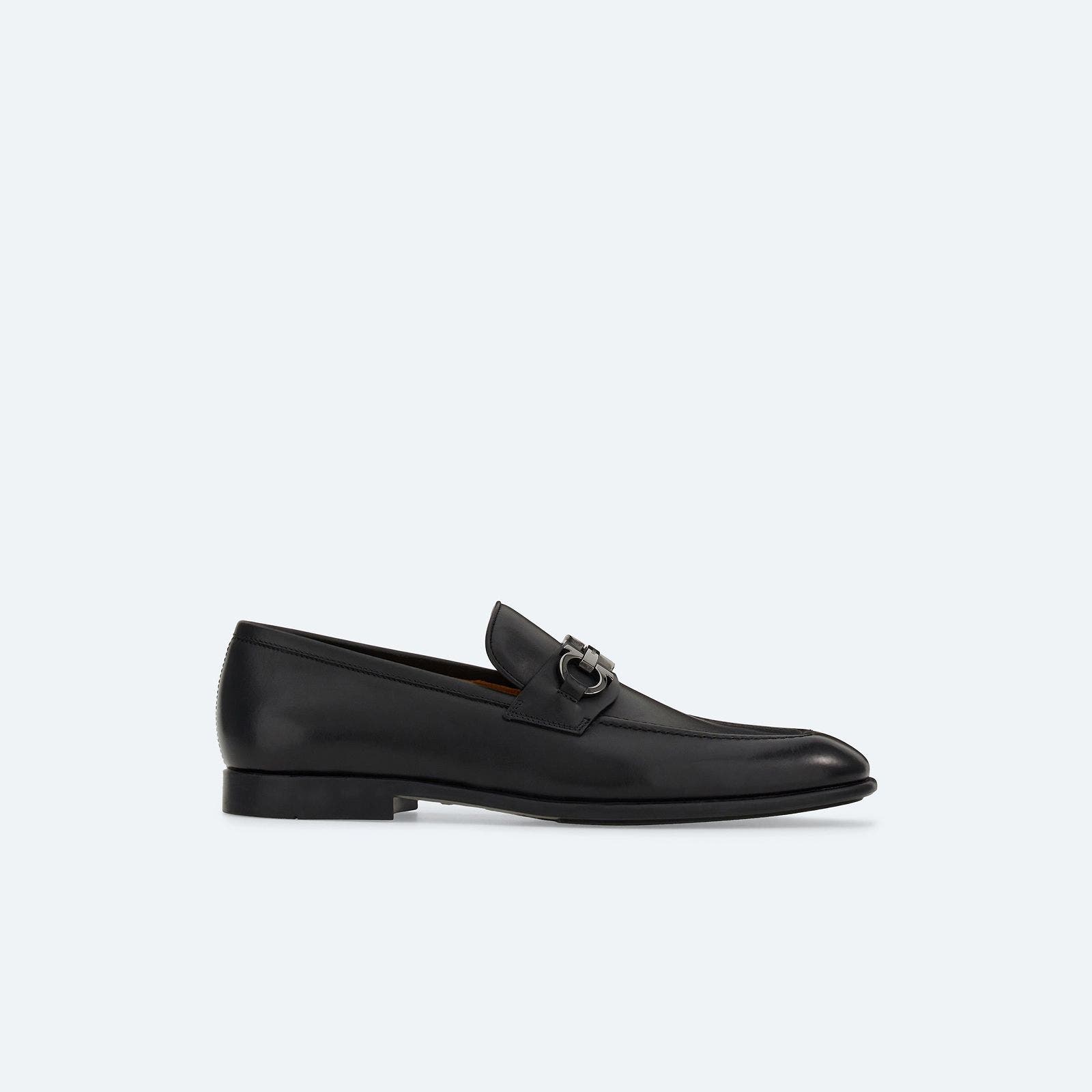 A black leather loafer.