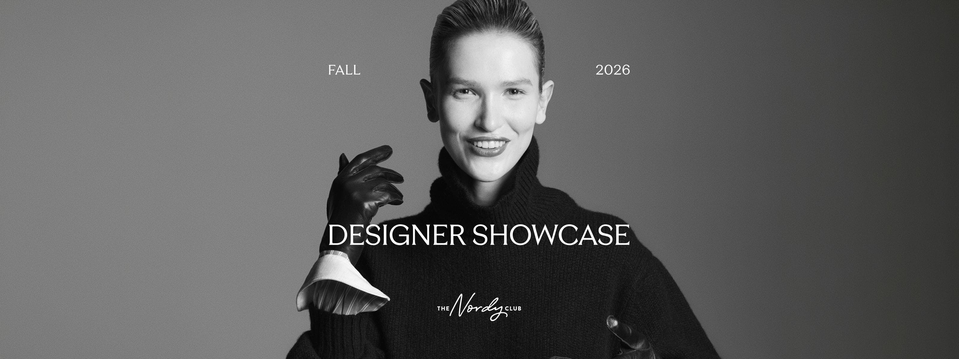 Fall 2026 Designer Showcase. Woman wearing a black turtleneck sweater and black gloves.