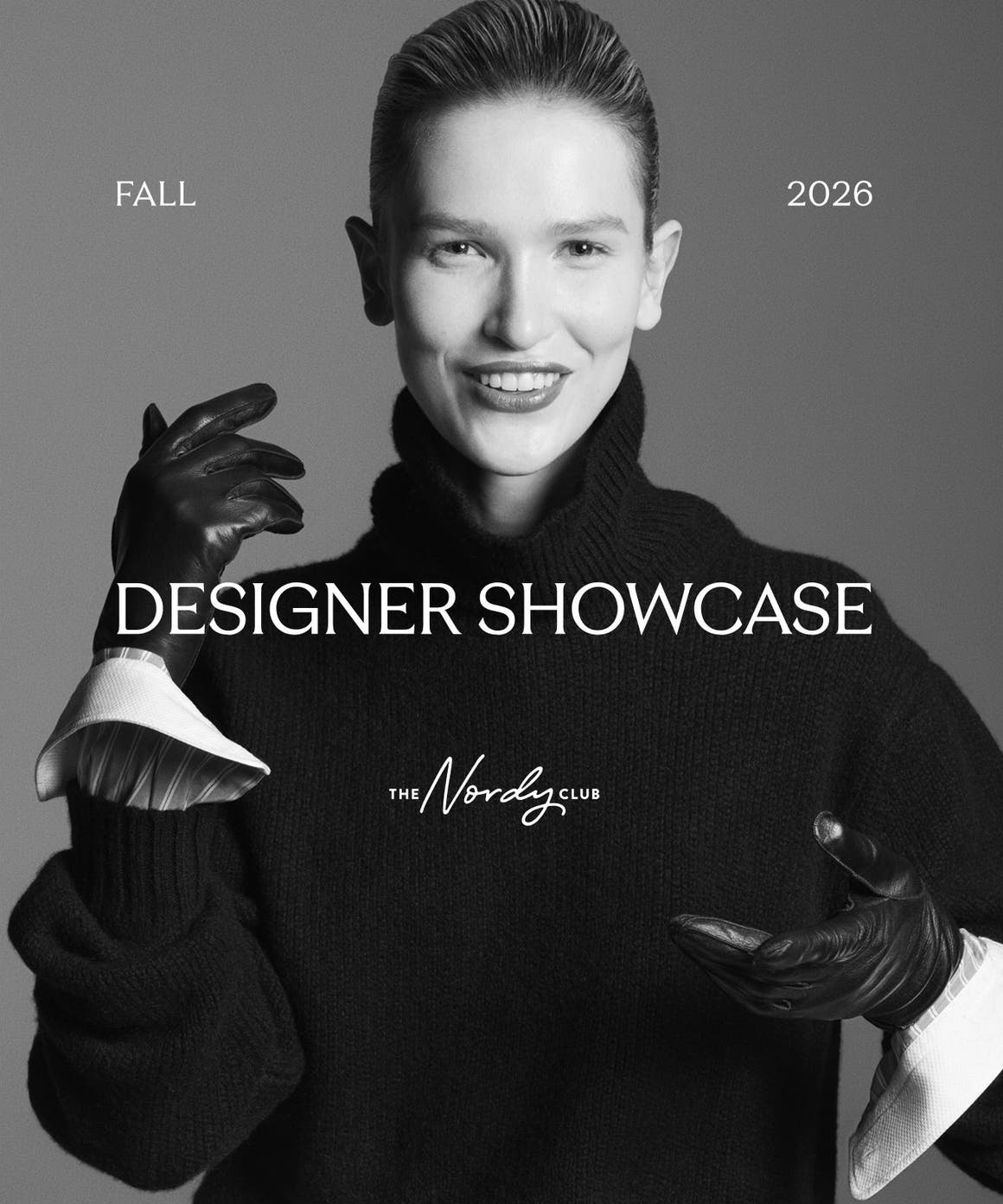 Fall 2026 Designer Showcase. Woman wearing a black turtleneck sweater and black gloves.