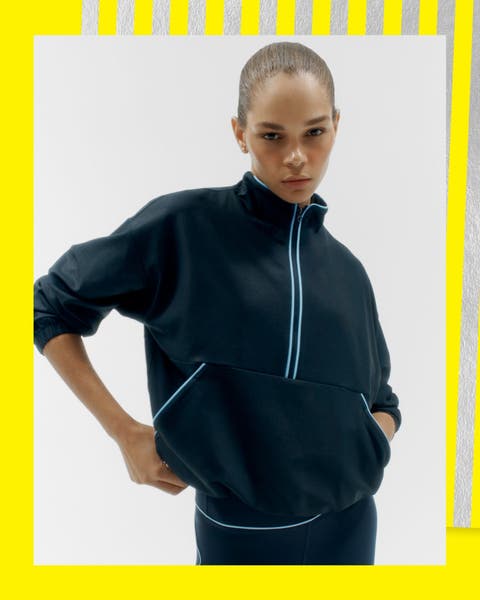 A woman wearing a fleece half zip.